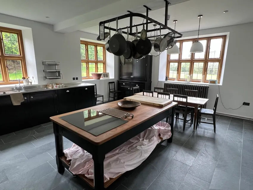 modern kitchen within traditional building in wales with contemporary fittings and large windows